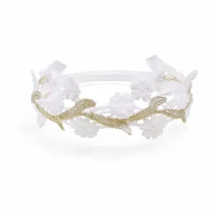 Close-up of white lace headband with hollow flowers and elegant golden embroidery