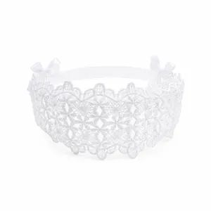 Detailed close-up of white lace baby headband with hollow floral pattern and cute bows.