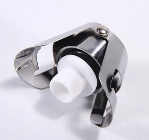 Close-up detail of the stainless steel champagne stopper with vacuum seal and locking arms