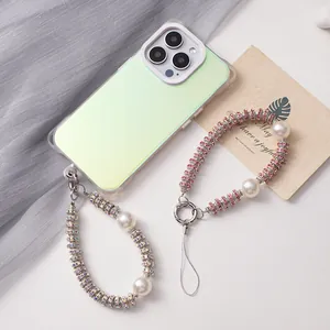Detailed macro shot of a luxury rhinestone and pearl phone charm with sparkling crystal beads
