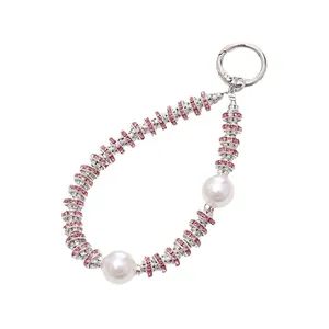 Luxury pink rhinestone and pearl phone charm strap with elegant silver ring clasp buckle