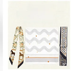 Detailed view of elegant faux silk scarf and twilly with horse and floral motifs