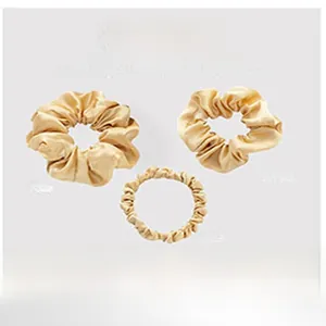 Comparison of three different widths of mulberry silk scrunchies in champagne gold finish