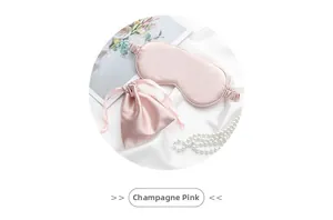 Detail of a champagne pink faux silk sleep mask and matching drawstring storage pouch