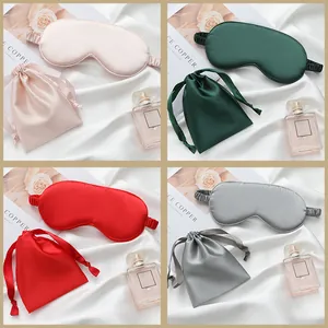Luxury faux silk sleep mask set with matching drawstring bag for blackout travel.