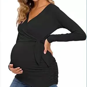 Comfortable long sleeve maternity nursing top with wrap V-neck design in classic black.