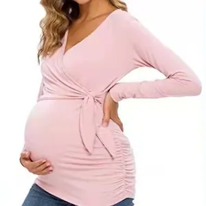 Elegant pink long sleeve V-neck maternity nursing top with side wrap tie detail