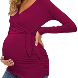 Elegant burgundy cross V-neck maternity nursing top with side ruching and long sleeves