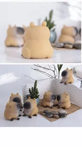 Adorable capybara squishy toys for stress relief, displayed with mini succulent props