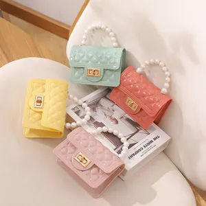 Colorful mini jelly handbags featuring pearl handles and diamond quilted design
