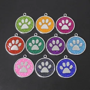 Detailed macro view of 30mm colorful glitter paw print dog tags made of zinc alloy