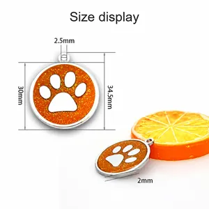 Detailed size measurements for the 30mm orange glittery dog paw print pendant charm