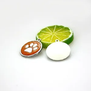 Detailed view showing the front and back of 30mm glitter dog paw zinc alloy pet ID tag