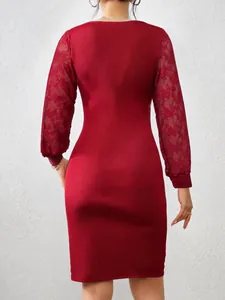 Close-up of the back showing red ribbed knit fabric and elegant lace sleeves.