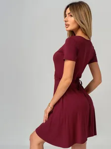 Burgundy short sleeve V-neck wrap dress for women, showing back tie detail and soft fabric texture