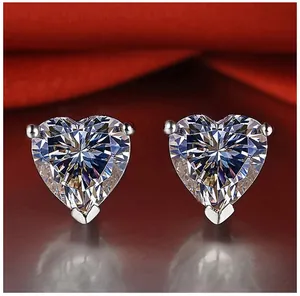Detail showing brilliant faceted cut of heart-shaped moissanite stud earrings