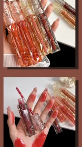 Maxfine mirror lip glaze with moisturizing water gloss effect and faceted clear tube design.