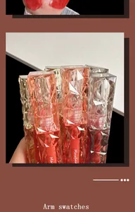 Detailed view of Maxfine glossy lip glaze tubes with diamond texture caps