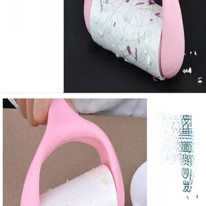 Close-up detail of a pink lint roller effectively removing hair and food crumbs