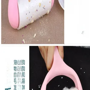 Close-up detail of a pink sticky lint roller removing pet hair and crumbs from carpet