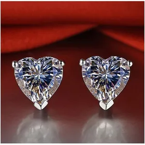 Elegant heart-shaped moissanite stud earrings in a classic three-prong silver setting