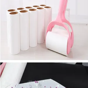 Detail view of pink lint roller set with multiple white paper refills