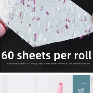 Close-up detail of a used lint roller sheet featuring 60 tearable diagonal layers for pet hair