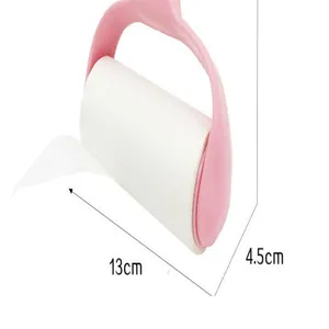 Detailed view of pink lint roller showing 13cm length and 4.5cm diameter dimensions