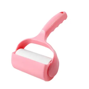 Pink portable tearable lint roller for efficient clothing and pet hair removal on white background
