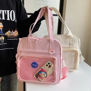 Detailed shot of a pink casual tote bag with a clear front pocket display, stylish design.