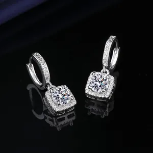 Close-up of elegant square halo hoop earrings with brilliant round center stones and pavé set.