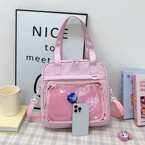 Detailed view of pink cute transparent crossbody tote bag with a mesh pocket and phone