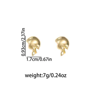 Detailed view of gold-tone American football helmet stud earrings with size markings