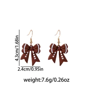 Detailed view of brown American football bow earrings with dimensions and weight info