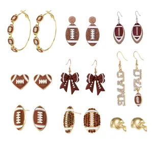 Detailed view of various American football themed earrings set for Game Day accessories