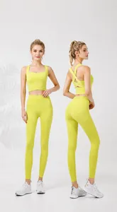 Detail view of lime green back-cross sports bra and high-waist yoga leggings set