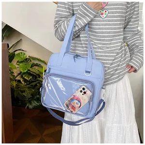 Light blue fashion ita bag with a large transparent front pocket for cute accessories