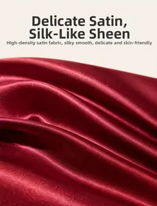 Detailed macro view of high-density red satin fabric with a smooth and glossy finish.
