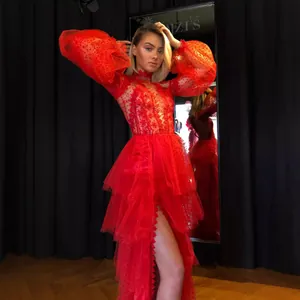 Elegant red tiered tulle prom dress with mesh long sleeves and embroidered bodice.