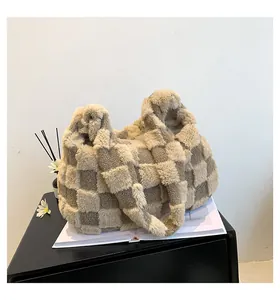 Close-up of a cozy plush checkerboard tote bag on a magazine for a stylish look.