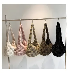 Plush checkered shoulder bags shown in five different colors on a clothing rack display