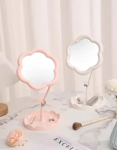 Elegant flower-shaped tabletop makeup mirror with jewelry storage tray in pink and white