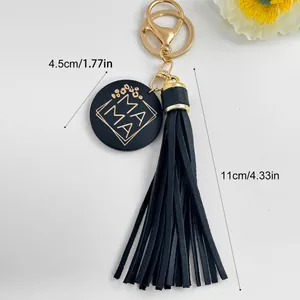 Gedetailleerd beeld van zwarte PU-kwast sleutelhanger met MAMA hanger en afmetingen