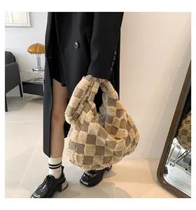 Large plush checkerboard tote bag featured in a stylish autumn/winter lifestyle setting.