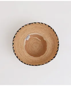 Top view showing the fine weave and interior label of a handcrafted raffia straw bucket hat