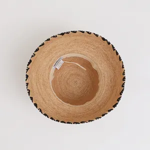Vintage raffia straw sun hat for women featuring interior detail and woven pattern