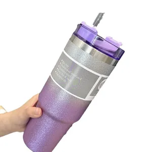 Close-up of purple gradient glitter stainless steel insulated travel tumbler with straw