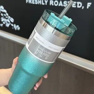 Teal glitter gradient vacuum insulated mug with straw and clear lid detail view