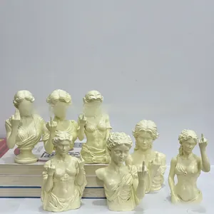 Set of funny cream resin goddess figurines showing middle finger gesture, parody desk decor
