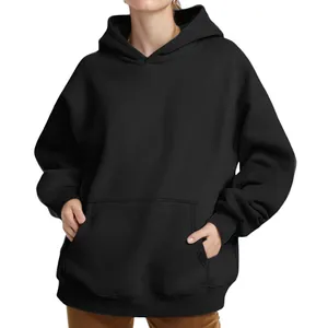 Detailed view of an oversized black hoodie featuring a kangaroo pocket and ribbed sleeve